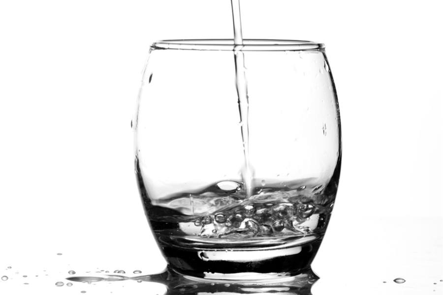 Clean water pouring into a glass